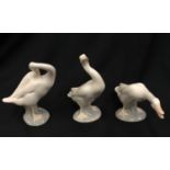 Three Lladro geese.