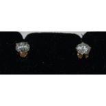 A pair of 0.60 carats (approx) 18ct diamond and 14ct yellow gold stud earrings.