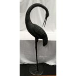 A large black metal decorative Heron statue. Approx 150cm tall.