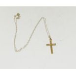 A 9ct yellow gold cross and chain.