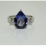 A large 5 carat (approx) D Block Tanzanite and Diamond 18ct white gold ring, Size R