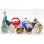 A collection of glass paperweights to include Caithness.