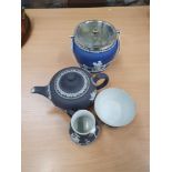 Wedgwood Black Jasperware teapot, milk pot and sugar bowl with a blue biscuit barrel.