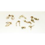 A quantity of 9ct gold earrings.