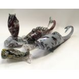 Four Murano glass fish.