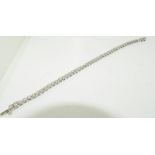 An 18ct white gold ladies diamond tennis bracelet, approx 3cts.