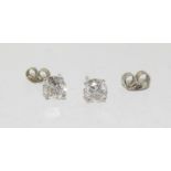 A pair of 14ct white gold diamond stud earrings of 1.8cts.