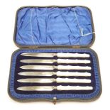 A boxed set of silver tea knives with Mother Of Pearl handles.