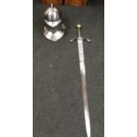 A reproduction medieval sword and jousting helmet.