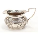 A silver H/M embossed cream jug.