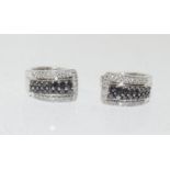 A pair of 18ct white gold Sapphire and Diamond earrings.