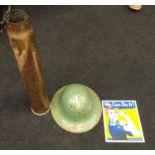A brass WW2 shell case dated 1943 together with a WW2 shape military helmet and an enamel sign