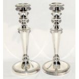 A pair of matching candlesticks 29 cm tall