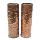 A good pair of copper and embossed vases Marked Newlyn