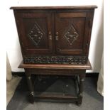 Charles II and later Oak cupboard on the stand.