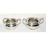 Silver milk jug and a matching silver sugar bowl