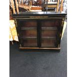 Black ebonised, ormolu mounted, glass fronted bookcase.