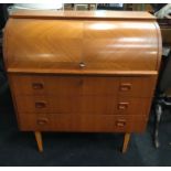 A mid century roll top bureau desk.