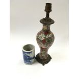 A Chinese table lamp cloisonne with blue and white pot.