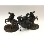 Oriental bronzed figure of a horseman together with a pair of spelter rearing horses.