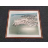 A framed picture of an aerial view of Poole Harbour.