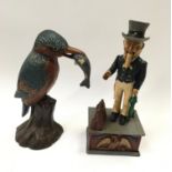 Cast iron Uncle Sam money box together with a cast door stop in form of a king fisher.