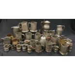 A collection of antique pewter mugs/measures.