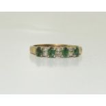 A 9ct gold Emerald and Diamond ring, Size S.