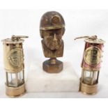 Brass paperweight in the form of a miner and two miniature miners lamps (Durham Miners Association