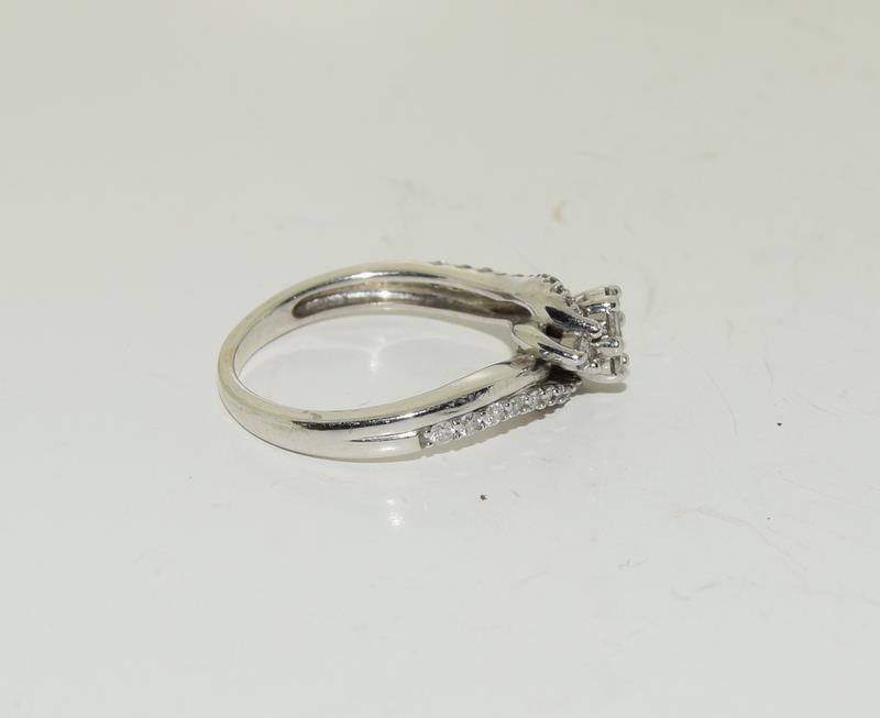 A Diamond cluster twist and diamond shoulder ring on white gold size L. - Image 2 of 3