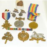 Quantity of WWI medals cap badges and other military badges