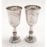 Pair of silver hallmarked tots, Birmingham 1910.