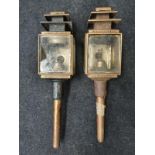 A pair of vintage carriage lamps.