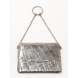 A silver card purse.