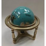 Table top globe with inset semi presious stones.