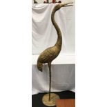 A large gold metal decorative Heron statue. Approx 195cm tall.