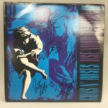 GUNS & ROSES AUTOGRAPHS. Here we find a copy of 'Use Your Illusion 2 album autographed in person