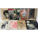 9 BOB DYLAN VINYL LP RECORDS. Titles to include - Hard Rain - Street Legal - Slow Train Coming -