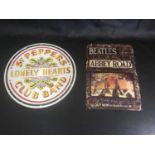 2 X METAL BEATLE PLAQUES. The first is advertising the Abbey Road album on Apple Records which