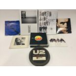 U2 COLLECTION OF BOOKS AND VINYL RECORDS. 2 books in this lot entitled ?No Line On The Horizon? plus