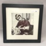 PAUL WELLER PRINT IN FRAME. This print of a young Paul Weller playing the guitar comes in a square