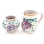 Poole Pottery Carter Stabler Adams shape 905 TR pattern jug together with a shape 303 vase.