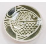 Poole Pottery studio pin dish depicting a stylized fish, mark 46, 1946-1966.