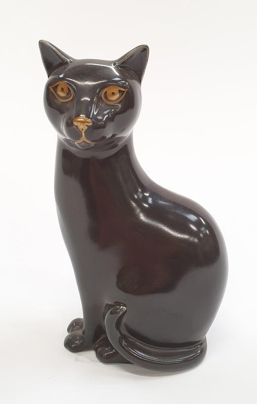 Poole Pottery unusual dark brown glazed cat with gold decorated eyes 6.5" high.