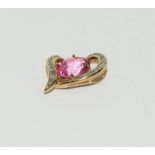 9ct gold pink topaz (3ct) and diamond pendant.
