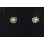 A pair of 18ct white gold diamond stud earrings off 77 points.