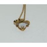 9ct gold opal and diamond heart shaped necklace.