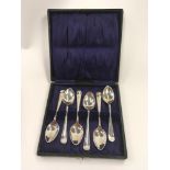 Six cased silver spoons.