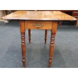 Edwardian oak drop leaf table with drawer to one end.