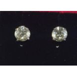 A substantial pair of white gold diamond stud earrings of approx 2cts.